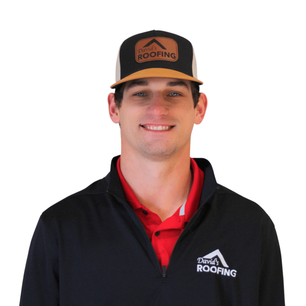 Man in a "David's Roofing" cap and black jacket with a red collar smiles against a plain background.