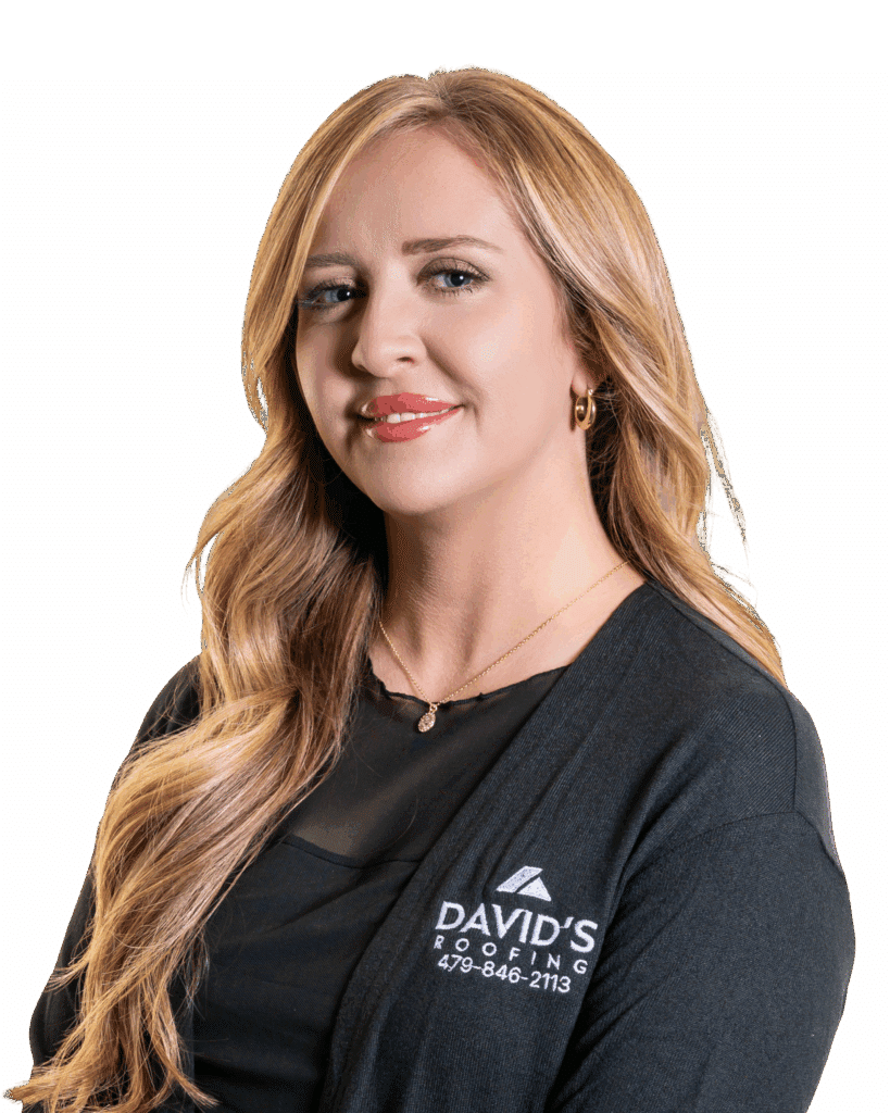 A woman with long blonde hair wearing a black top and a cardigan with the logo "DAVID'S ROOFING 479-846-2113" poses against a plain white background.