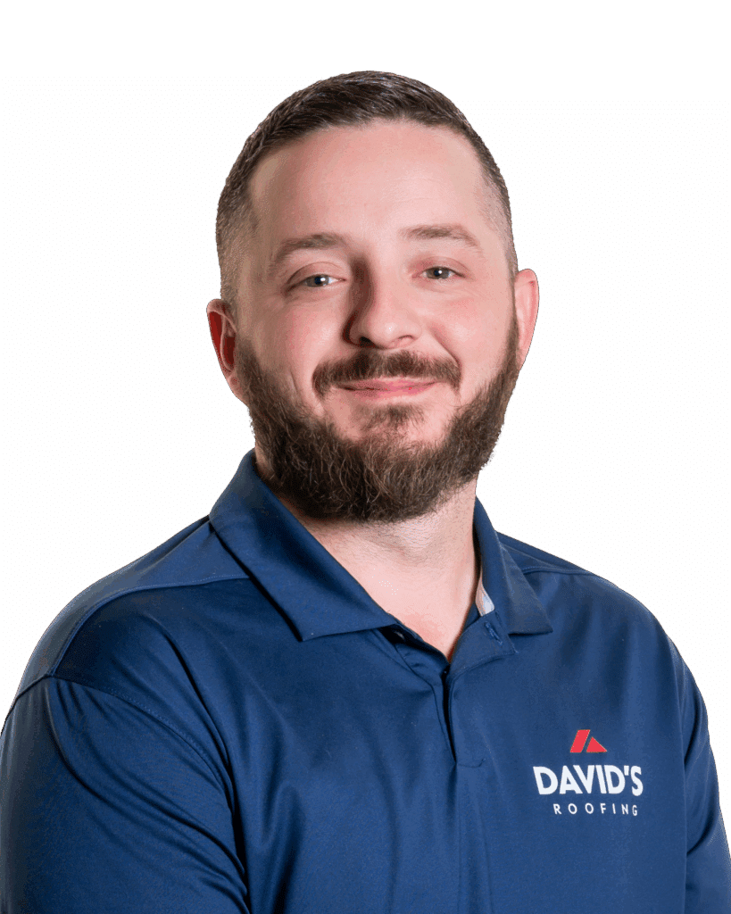 A man with short hair and a beard wearing a blue polo shirt with the "DAVID'S ROOFING" logo, standing against a plain white background.