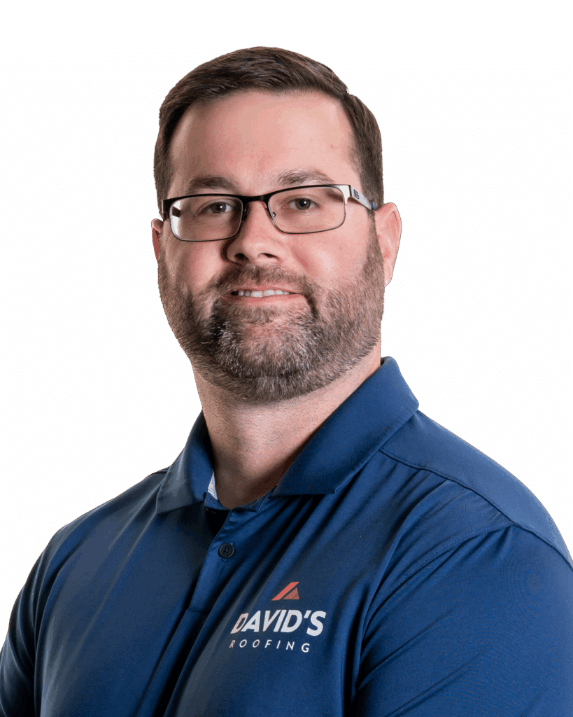 A man with short brown hair, glasses, and a beard is wearing a blue polo shirt with "David's Roofing" logo, standing against a plain white background.