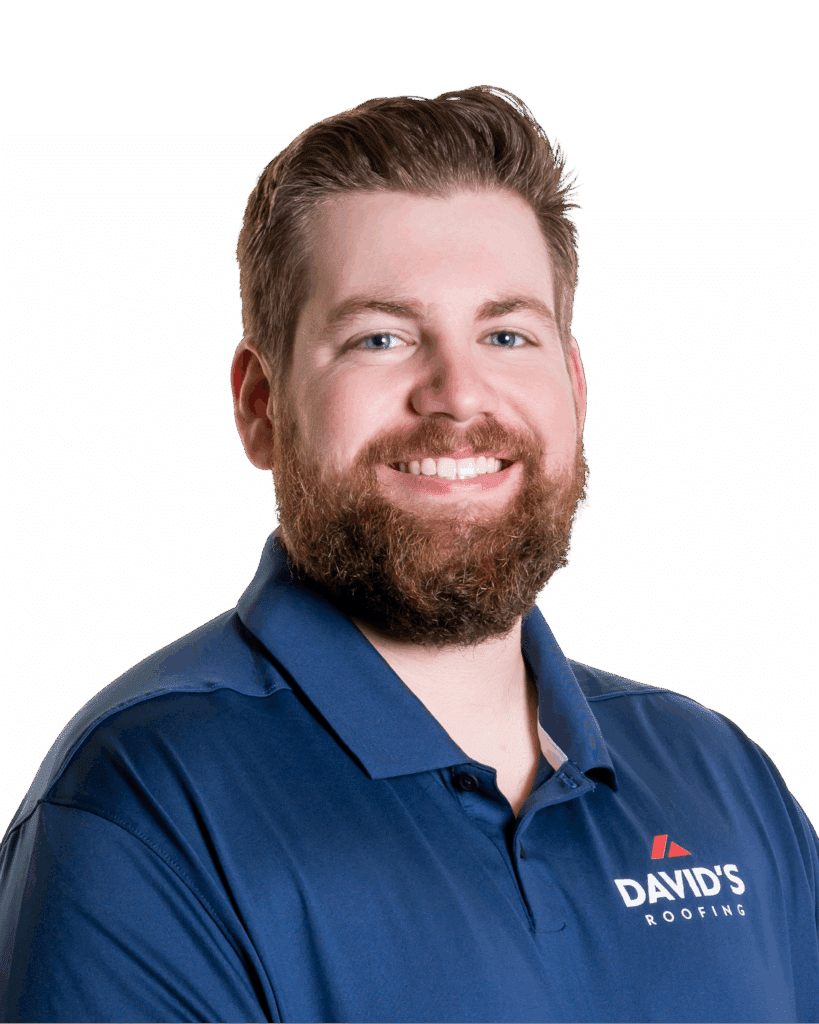 A man with a beard wearing a navy blue polo shirt with the "David's Roofing" logo, smiling at the camera against a plain white background.